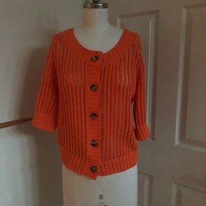 Cropped orange crochet sweater